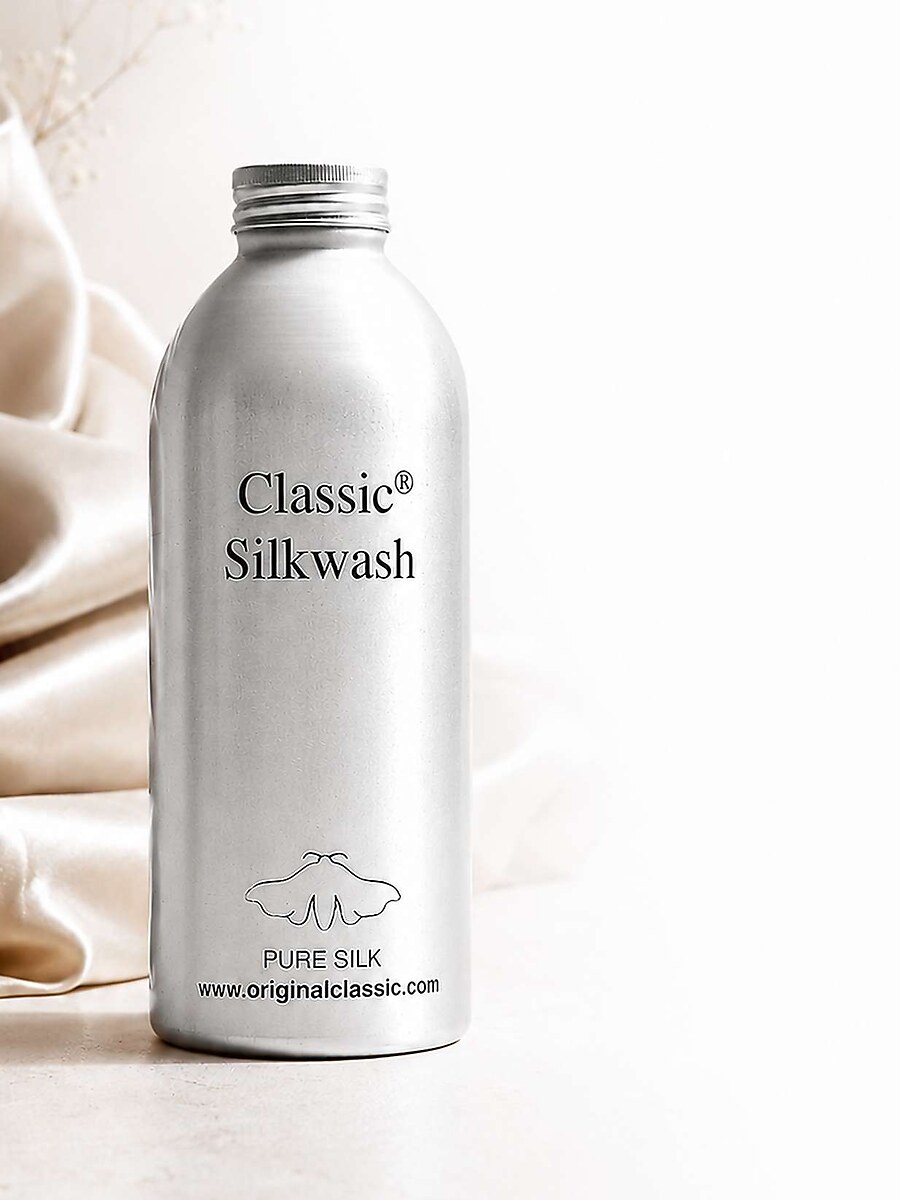 Classic Silkwash-flaske med blød silke i baggrunden